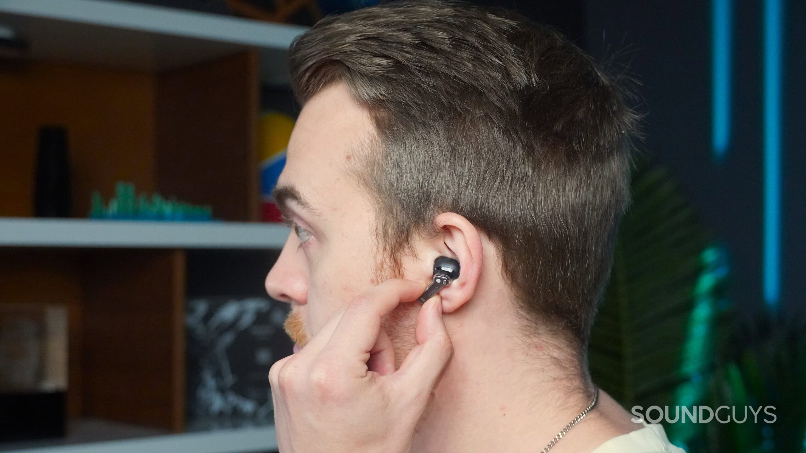 a man using pinch controls on the Nothing Ear a man using pinch controls on the Nothing Ear