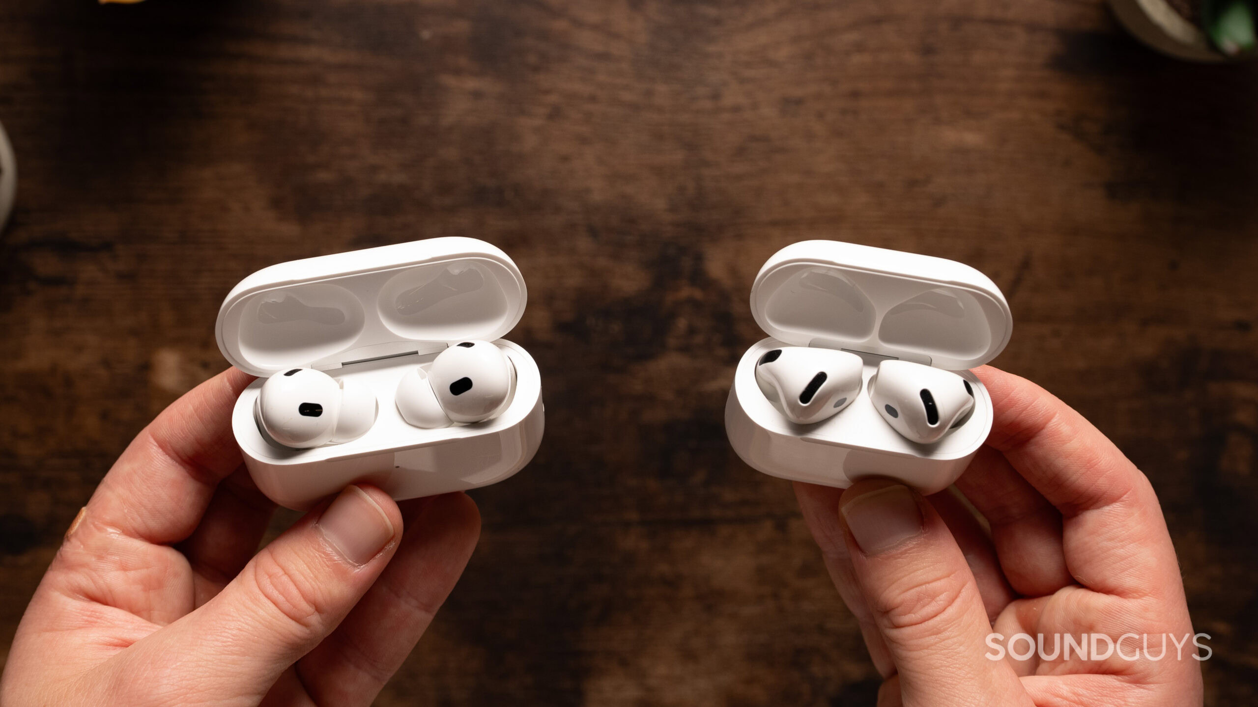 AirPods 4 vs AirPods Pro 2 in case 2 AirPods 4 with Active Noise Cancellation next to AirPods Pro 2 with case open.