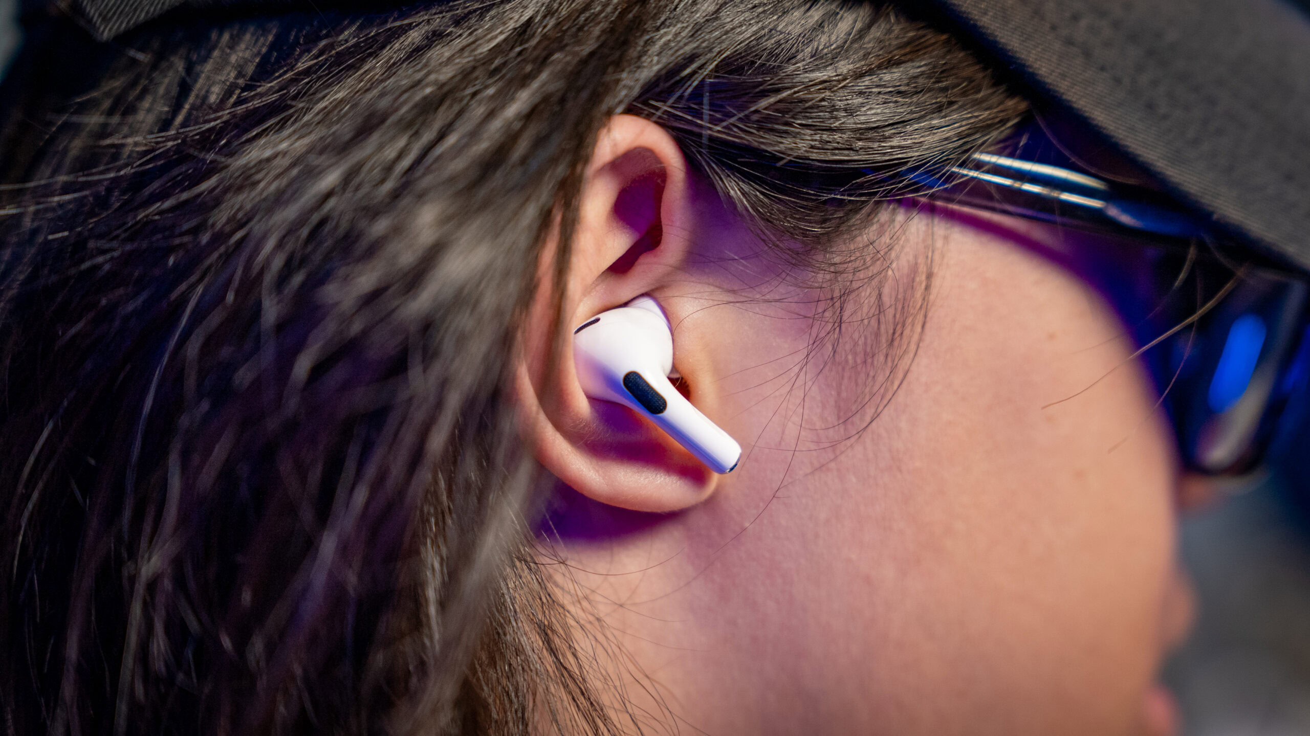 airpods pro 2 in right ear AirProds Pro 2 right earbud in right ear of man