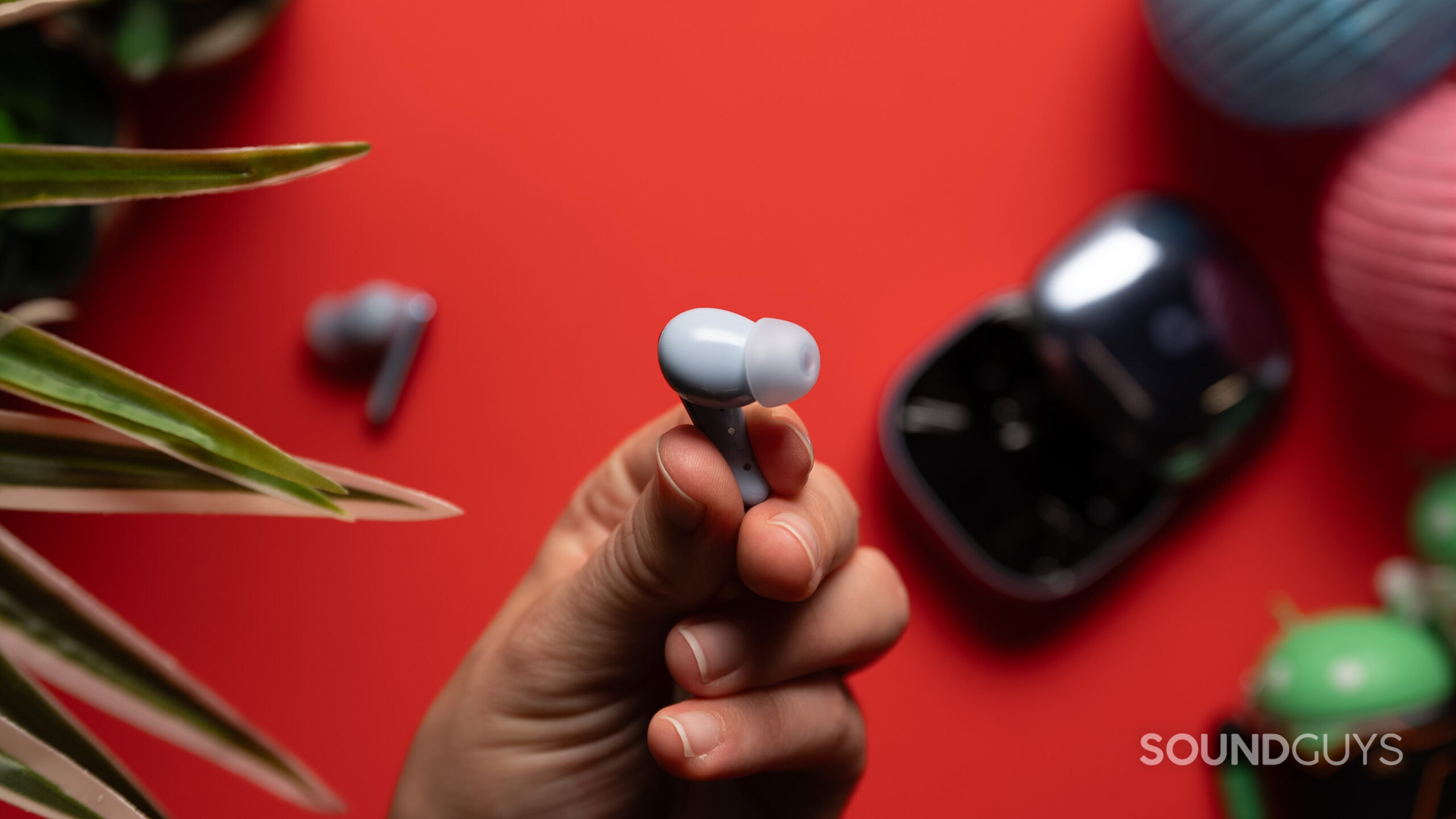 Anker Soundcore Liberty 4 Pro earbud A hand holds an Anker Soundcore Liberty 4 Pro earbud.