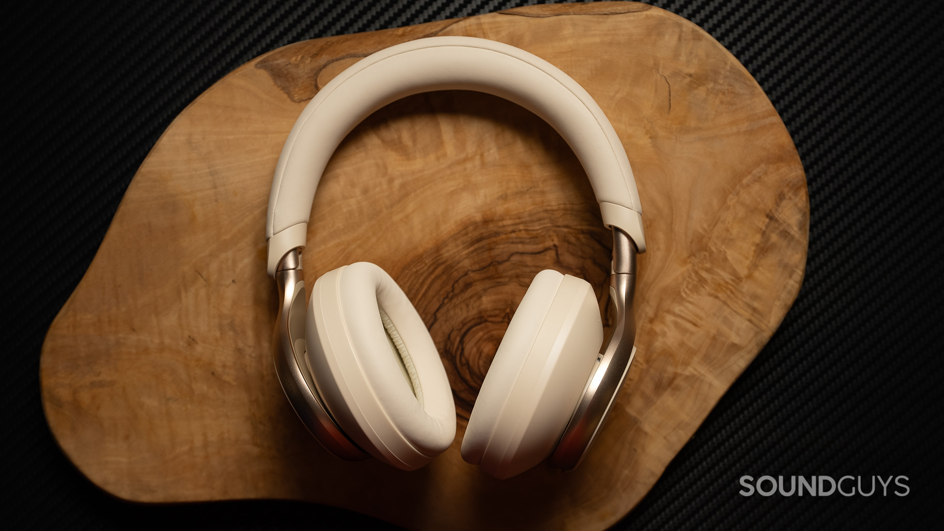 Anker Soundcore Space One hero 2 Anker Soundcore Space One headphones on a wood surface.