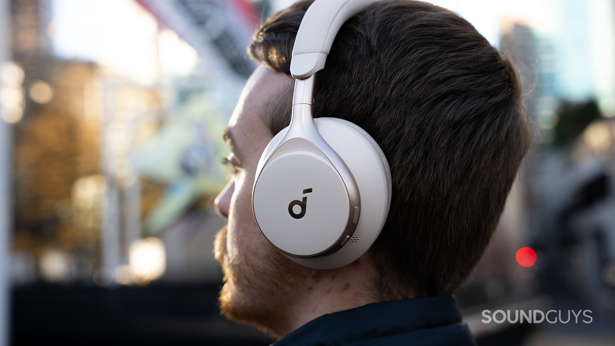 Anker Soundcore Space One on man close up Anker Soundcore Space One headphones on a person looking out into the distance.