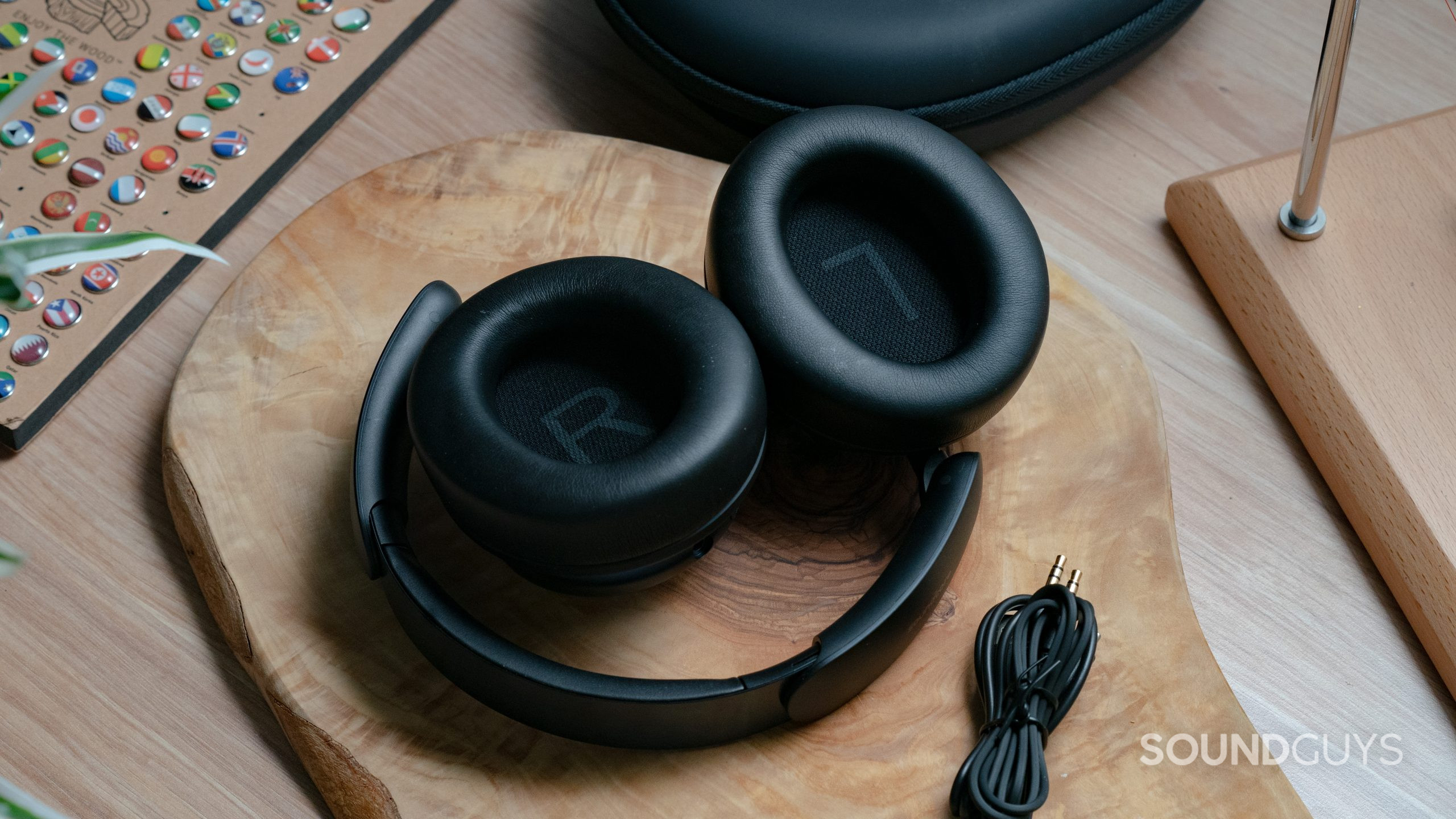 Anker Soundcore Space Q45 wooden table contracted The Anker Soundcore Space Q45 sitting on a wooden table with the headset folded up.