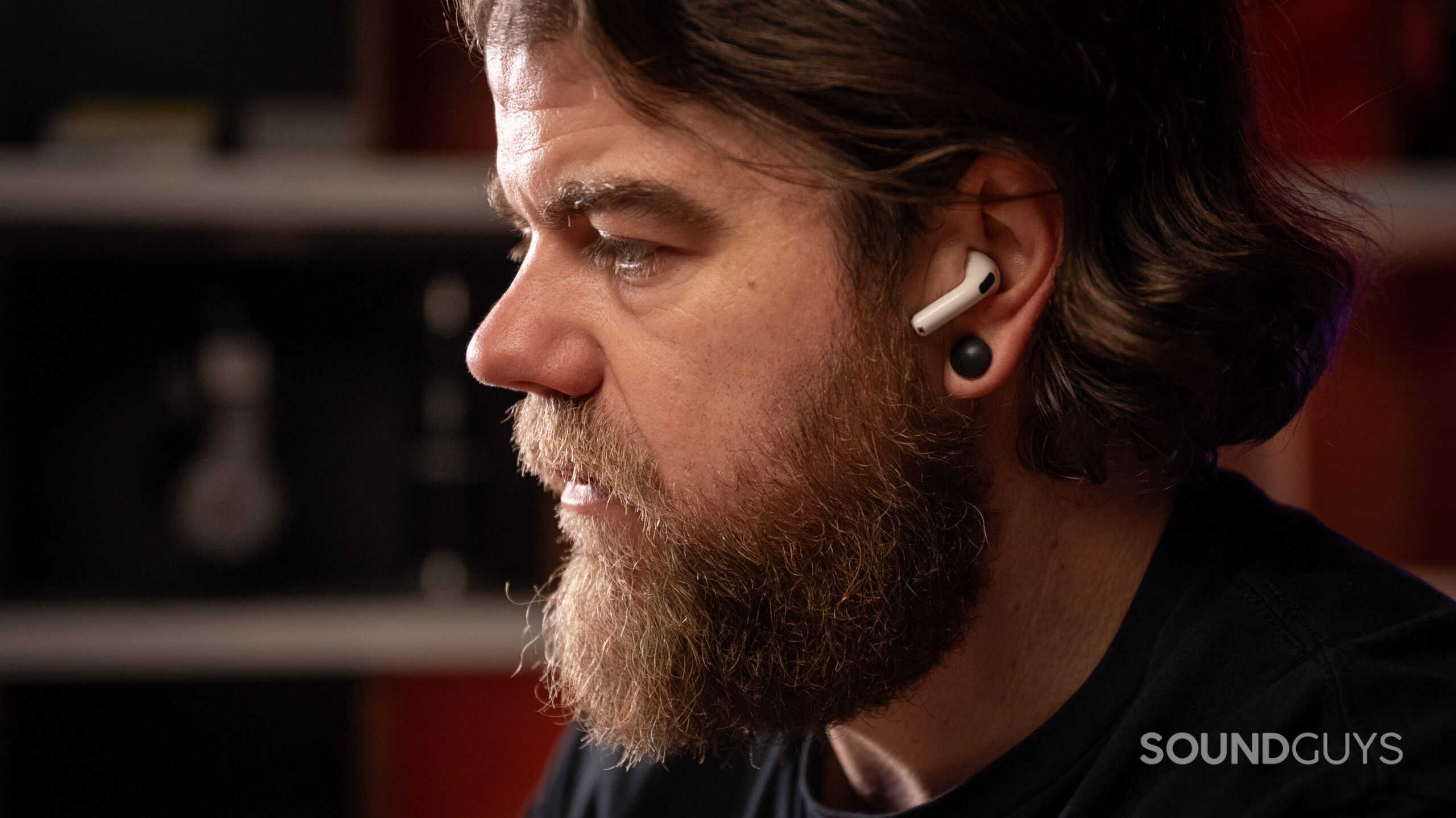 Apple AirPods 4 man wearing while working close up a man wearing the airpods 4