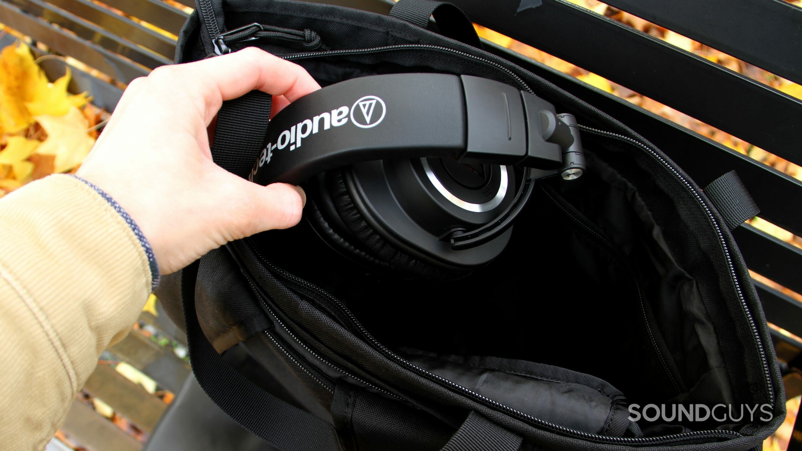 audio-technica-ath-m50xbt2-bag-stow Audio-Technica ATH-M50xBT2 getting stowed away in a black bag.