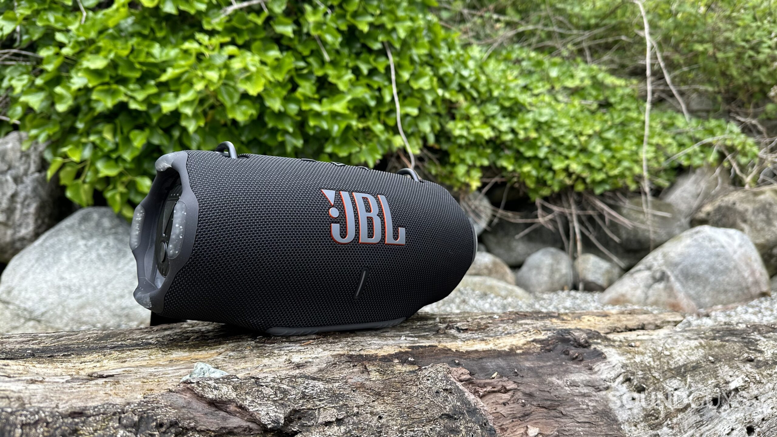 JBL Xtreme 4 rock The JBL Xtreme4 placed on a rock.