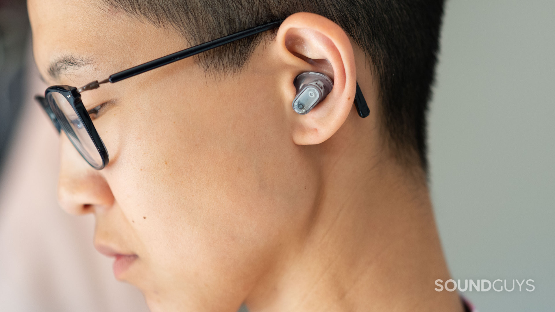 Beats-Studio-Buds-Plus-person-wears-earbuds-profile A photo of a woman wearing the Beats Studio Buds Plus.
