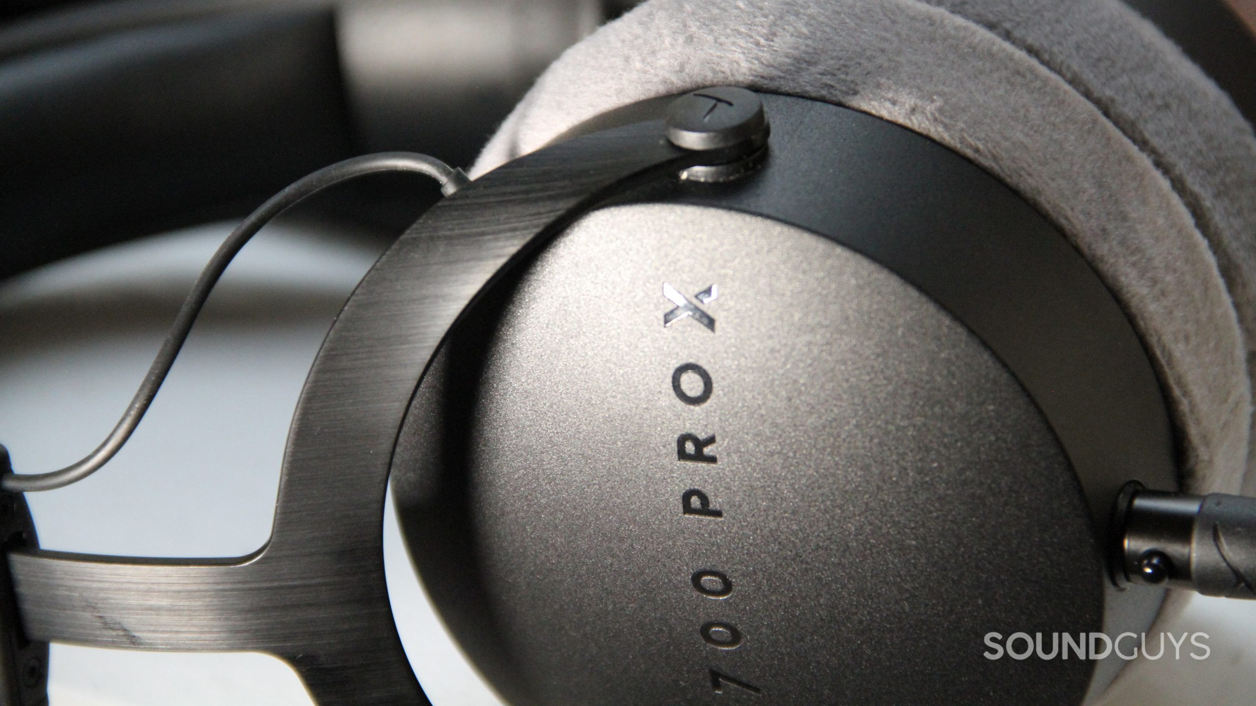 beyerdynamic-dt-700-pro-x-close-up A close up of the Beyerdynamic DT 700 Pro X displaying the brushed and textured metal housing.
