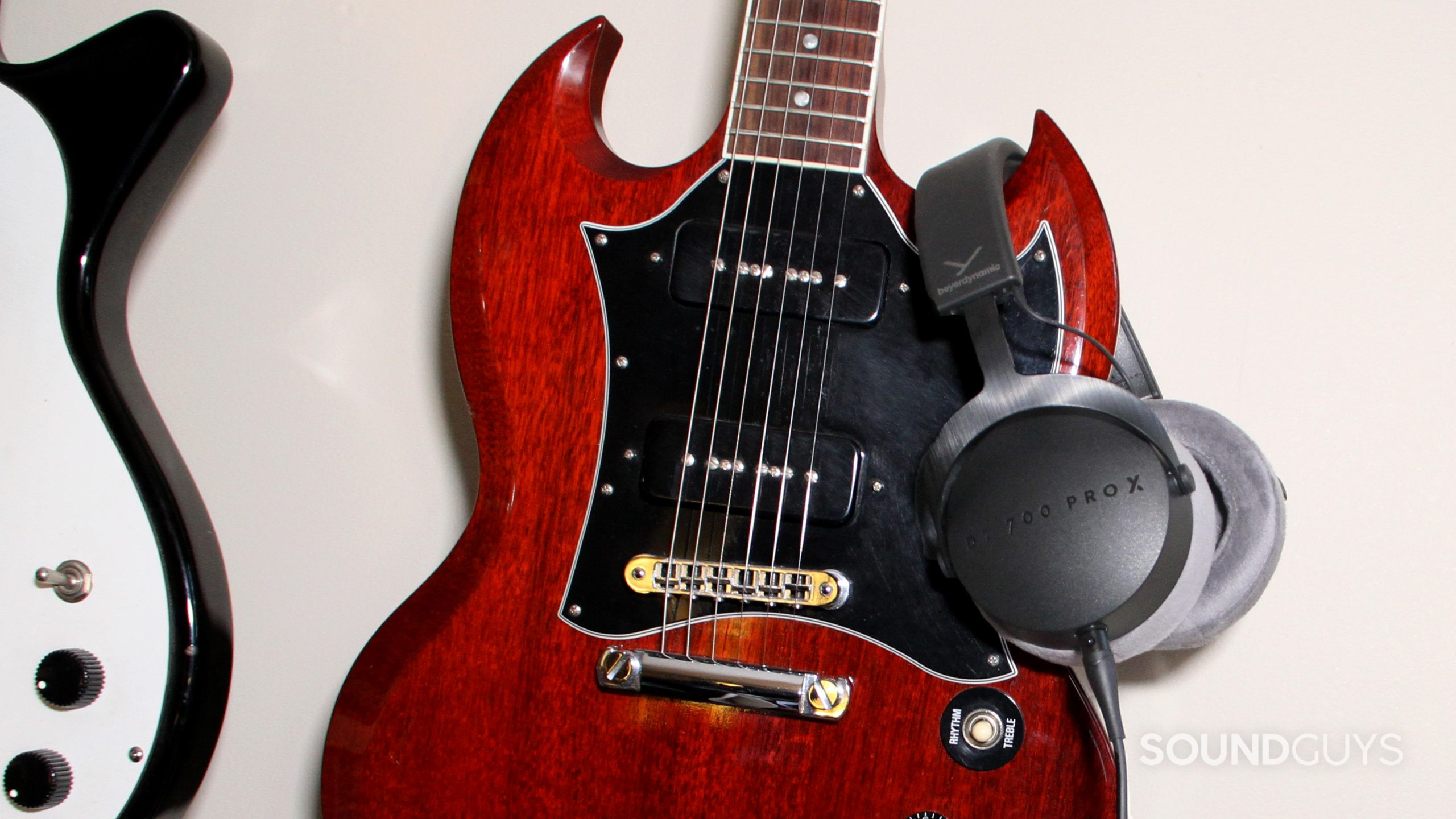 beyerdynamic-dt-700-pro-x-guitar Beyerdynamic DT 700 Pro X slung over the horn of an electric guitar.