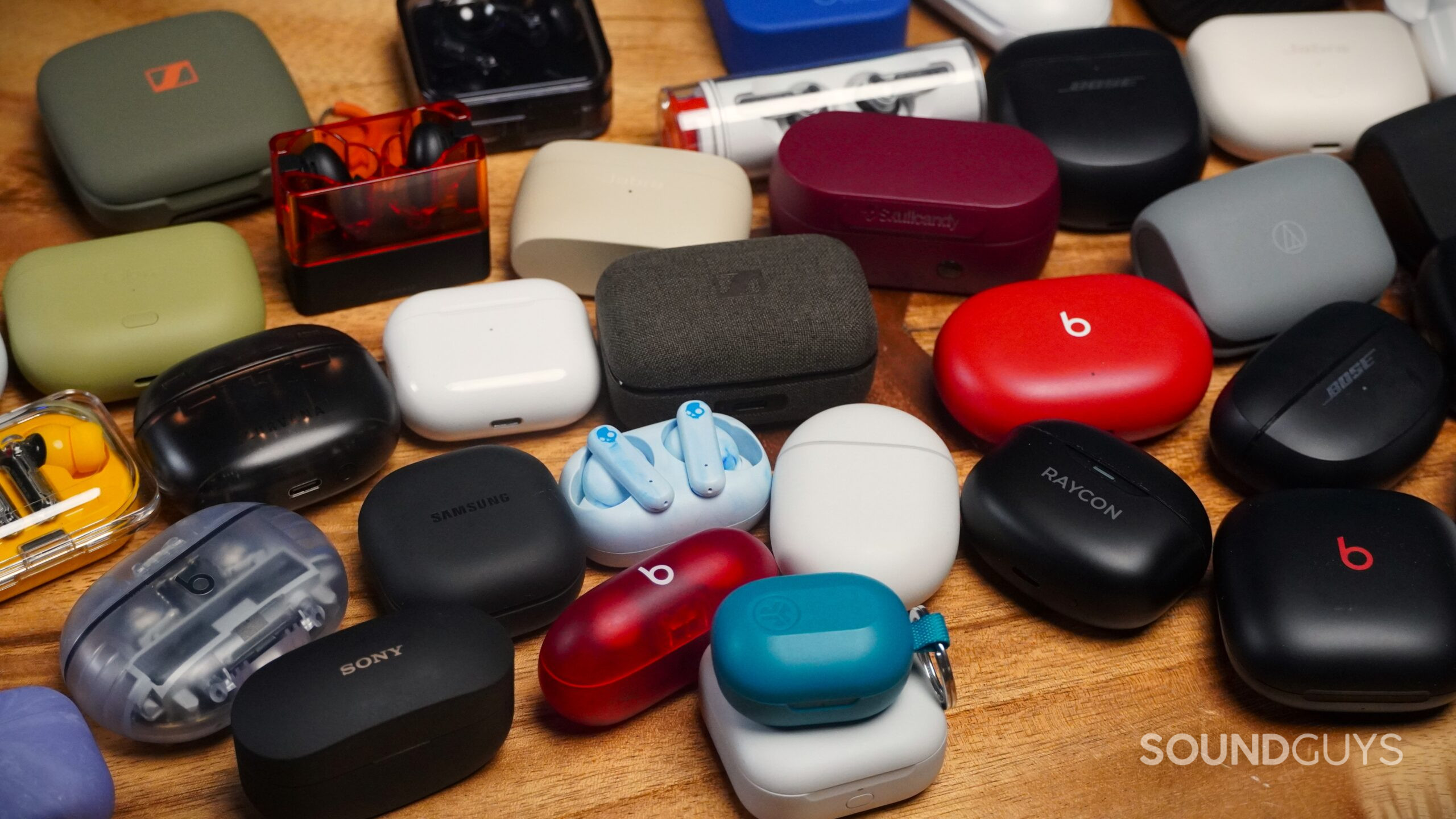 earbuds cases a bunch of earbuds in their cases