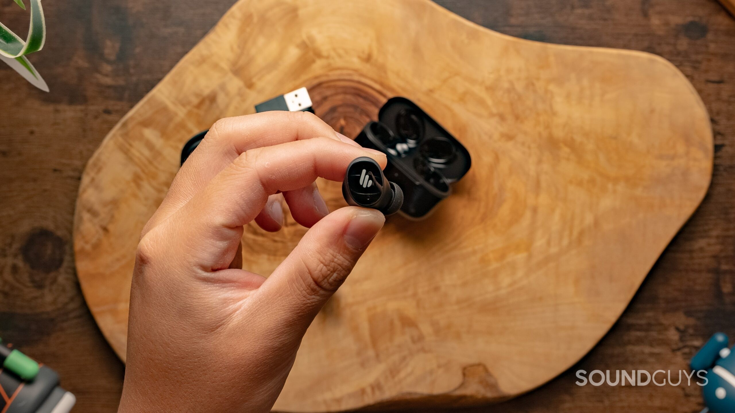 Edifier TWS1 Pro 2 Ear Buds Hero Image #2 Edifier TWS1 Pro 2 earbuds held in a hand.