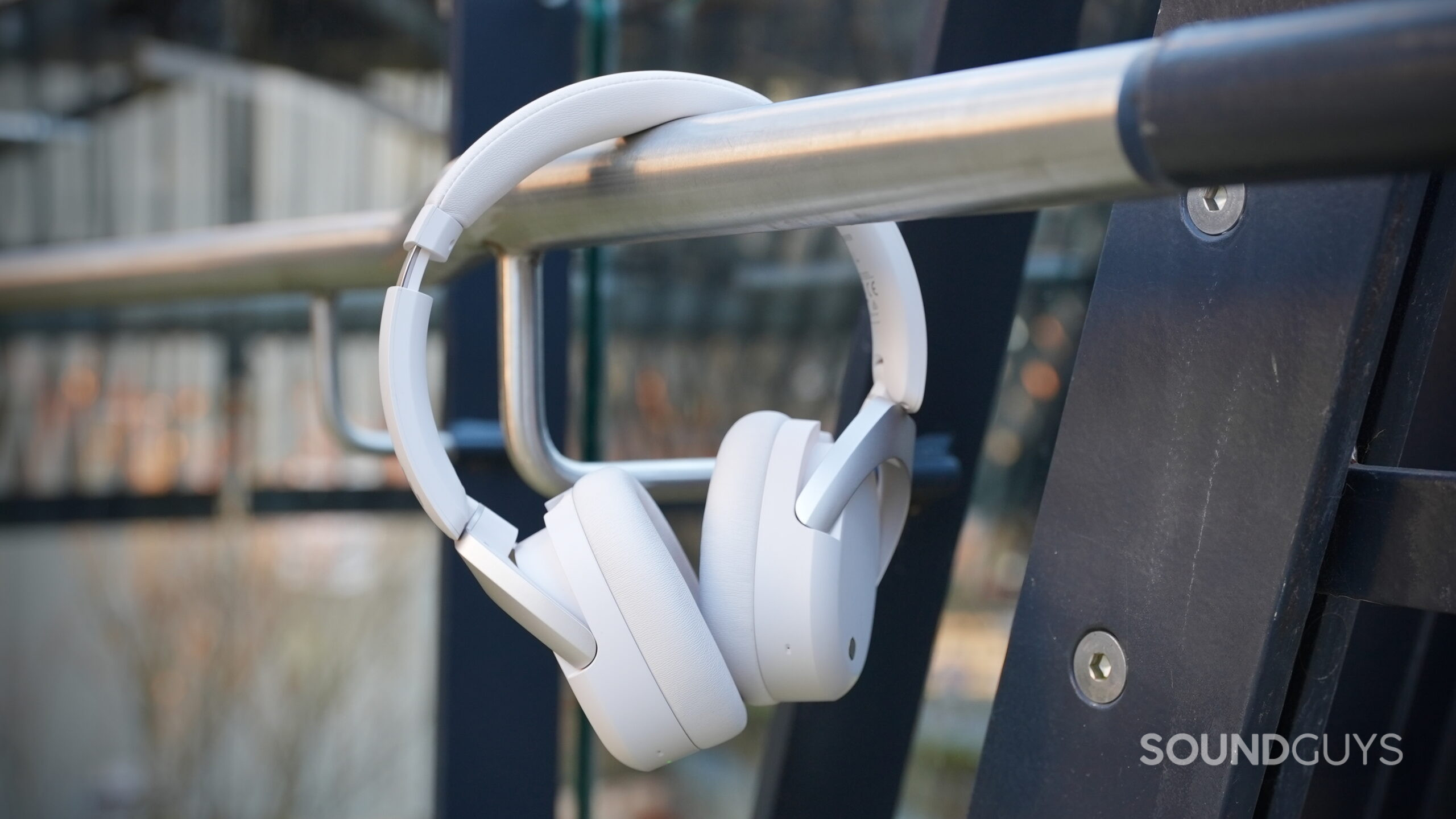 Edifier W830NB_3 The Edifier W830NB headphones hanging off a hand rail.