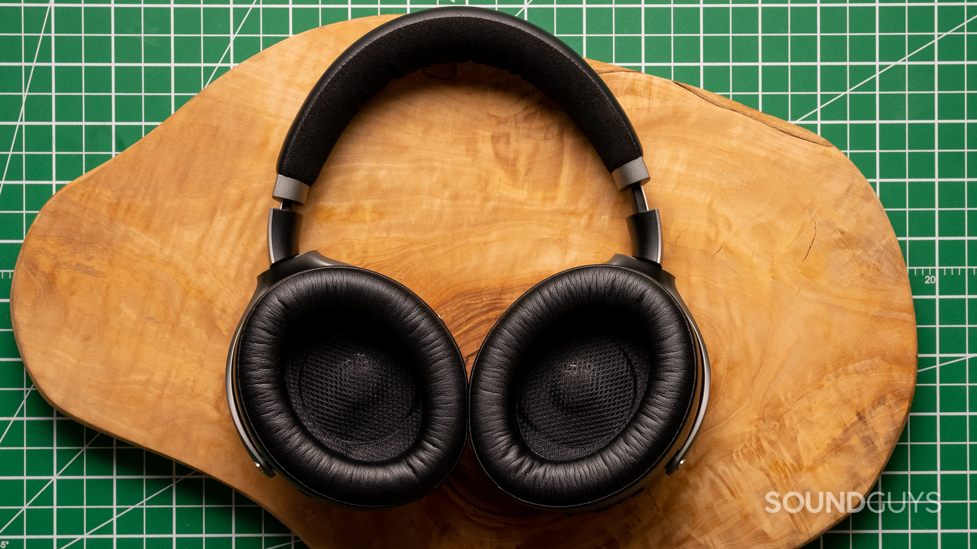focal-bathys-ear-cups A photo of the Focal Bathys sitting atop a wood slab, with the ear cups facing the reader.