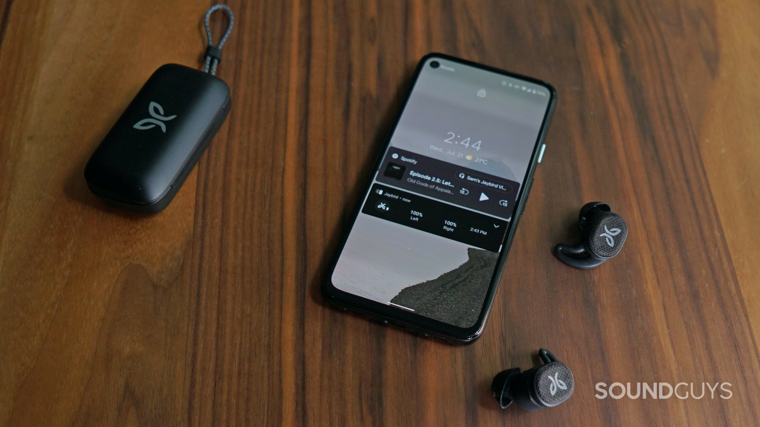 Jaybird-Vista-2-phone-integration-shot Jaybird Vista 2 earbuds and case next to smartphone.