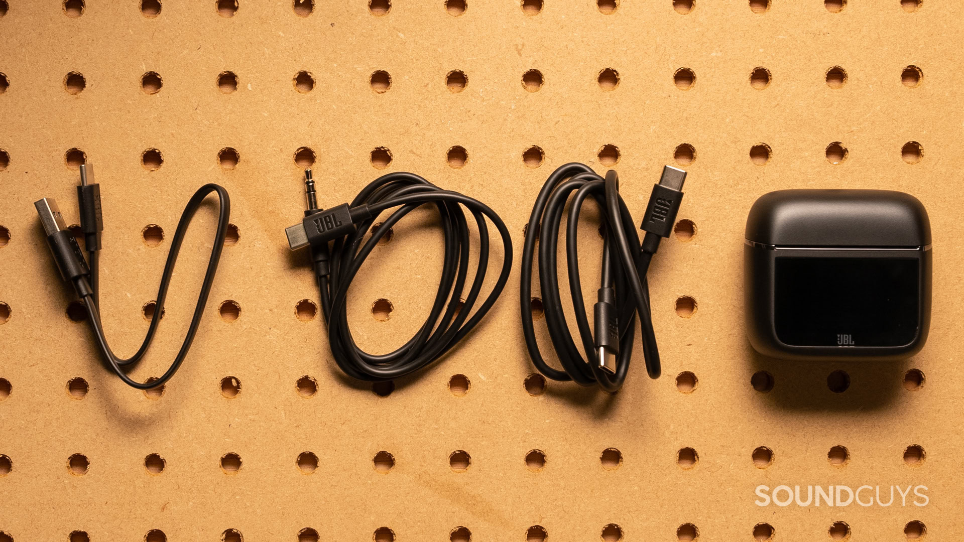 jbl-tour-pro-3-connections A photo of all the cables included with the JBL Tour Pro 3.