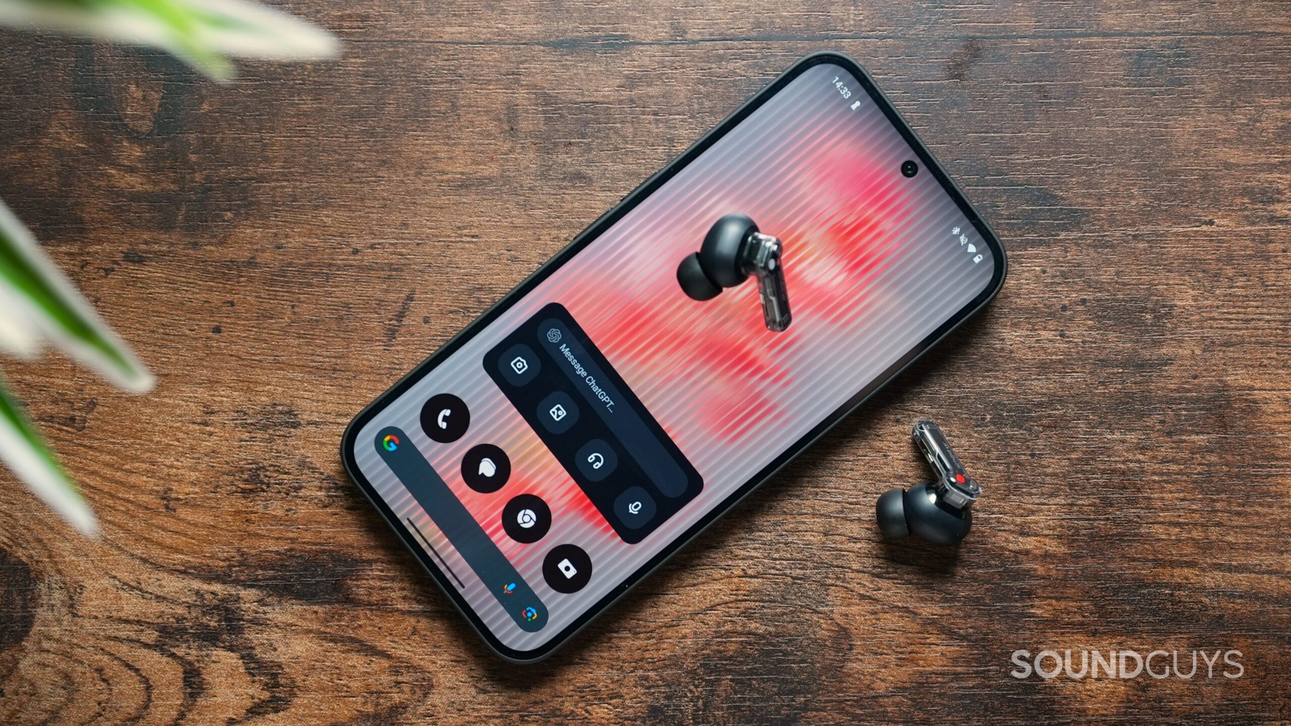 Nothing Phone 2(a) with ChatGPT widget on screen and Nothing Ear earbuds Nothing Phone 2(a) with ChatGPT widget on screen and Nothing Ear earbuds