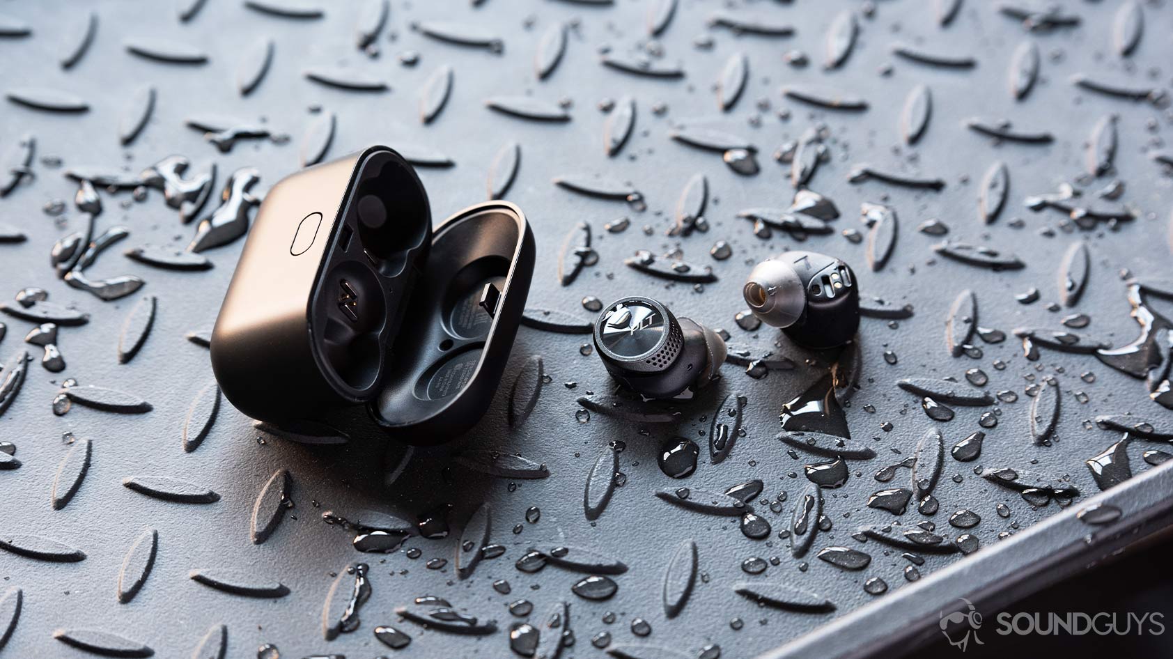 Plantronics BackBeat Pro 5100-true wireless earbuds case water resistant ip A picture of the Plantronics BackBeat Pro 5100 true wireless earbuds outside of the case and surrounded by water splashes.