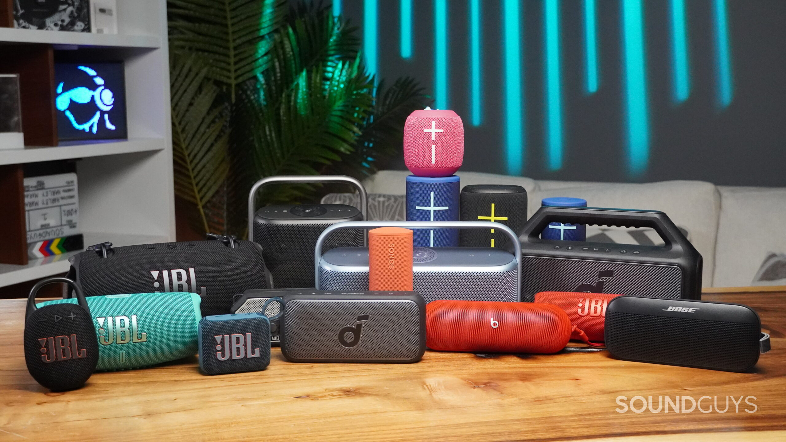 portable bluetooth speakers hero a bunch of portable bluetooth speakers on a table