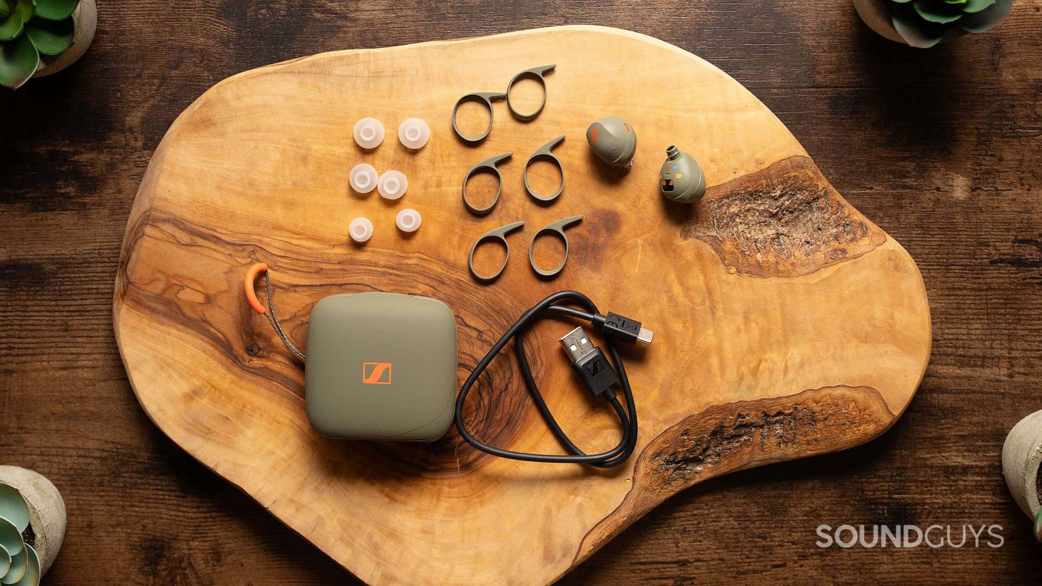 Sennheiser MOMENTUM Sport accessories Sennheiser MOMENTUM Sport earbuds alongside the extra wing tips, ear tips, and charging cable.