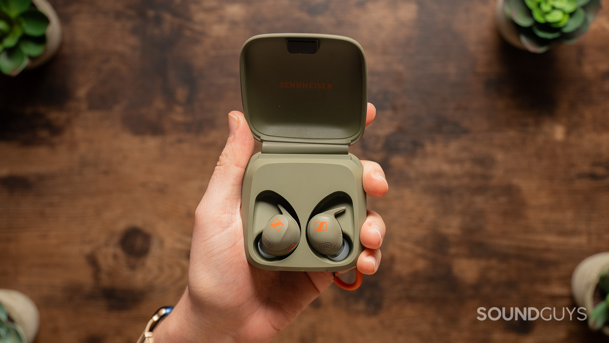 Sennheiser MOMENTUM Sport hero 1 Sennheiser MOMENTUM Sport earbuds in charging case.