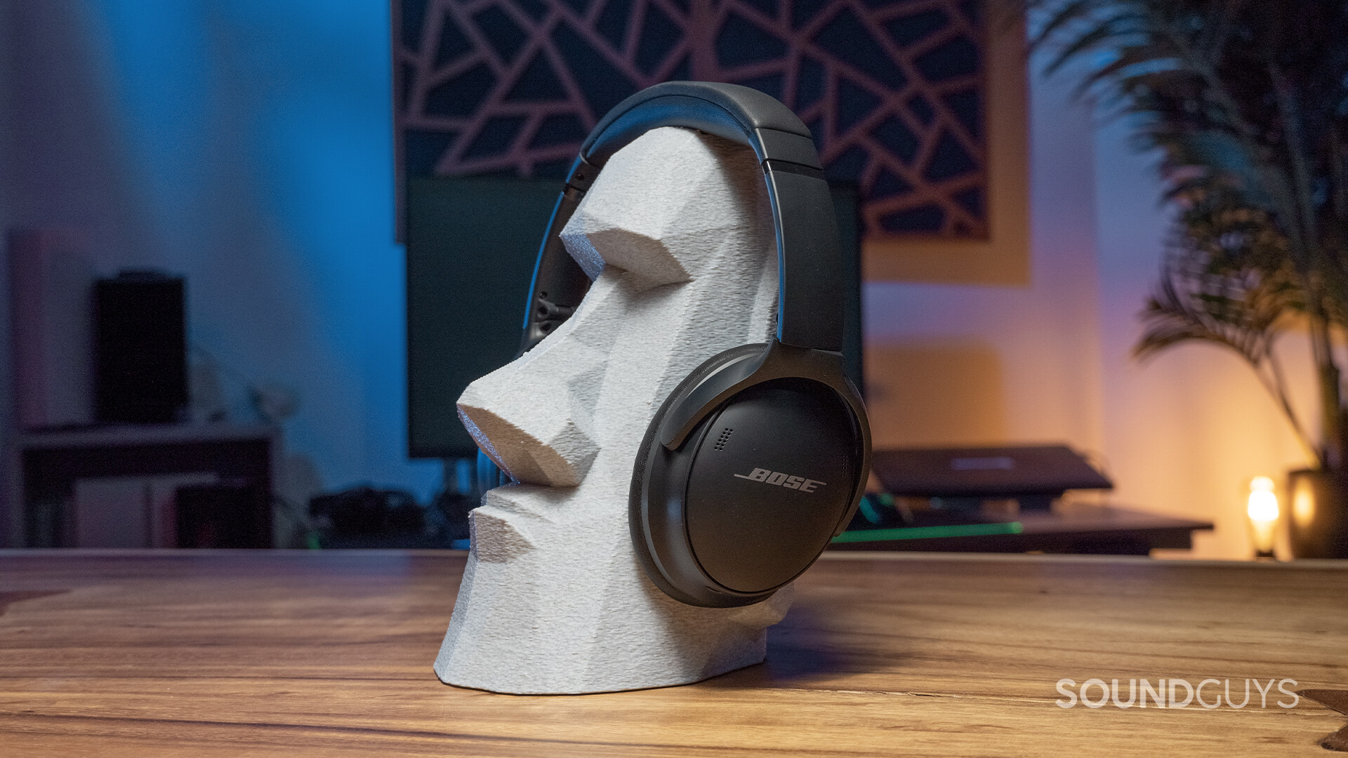 SG_Bose QuietComfort 45_3 The Bose QuietComfort 45 headphones on a statue head.