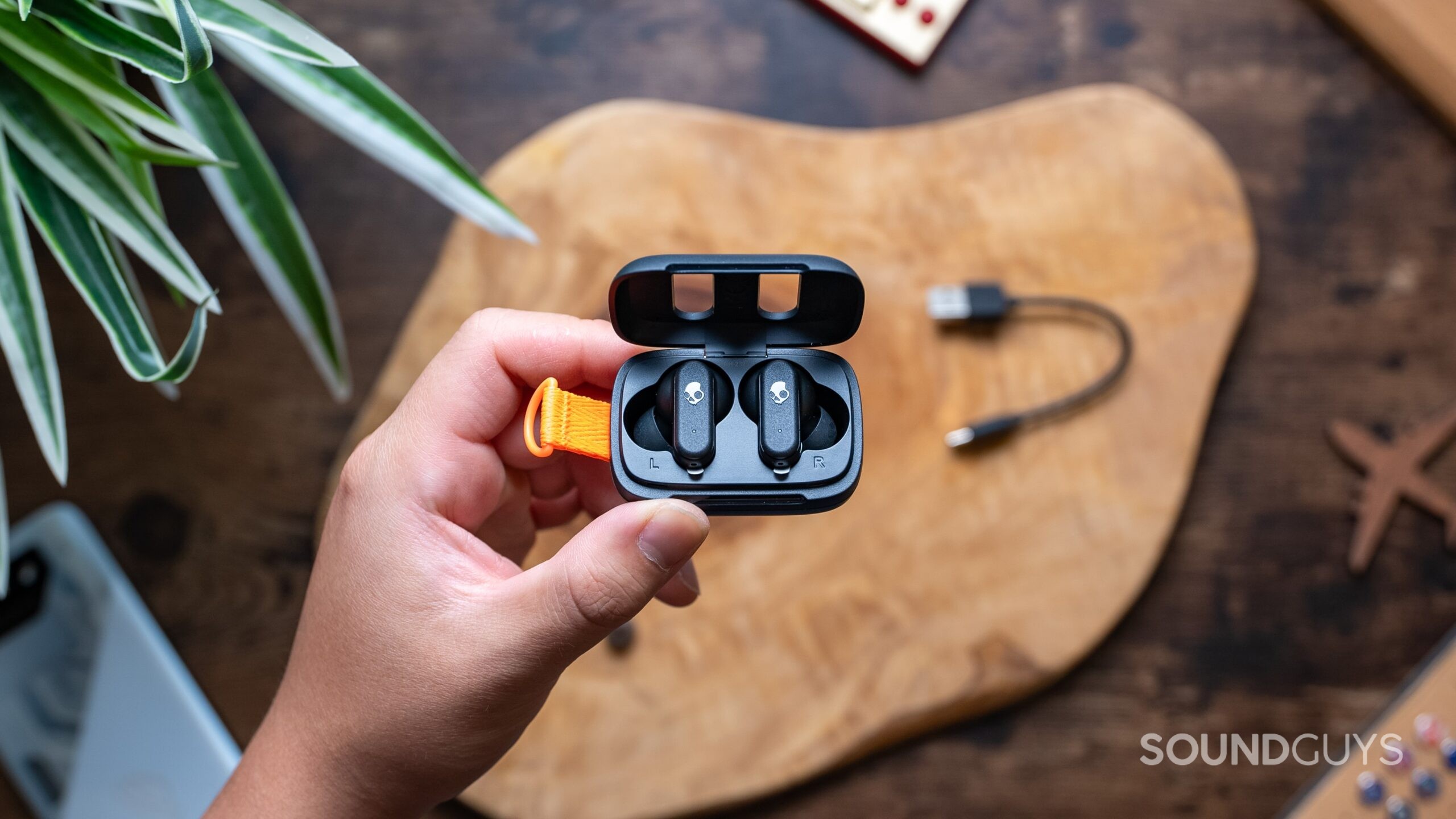 Skull Candy Dime 3 Wireless Earbuds Hero Image #1 Skullcandy Dime 3 earbuds held in a hand.