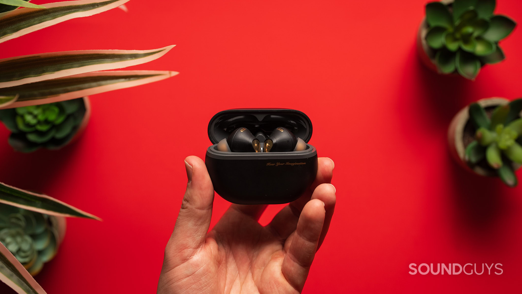 SoundPEATS Capsule3 Pro Plus earbuds in case held in hand A hand holds the SoundPEATS Capsule3 Pro Plus earbuds.